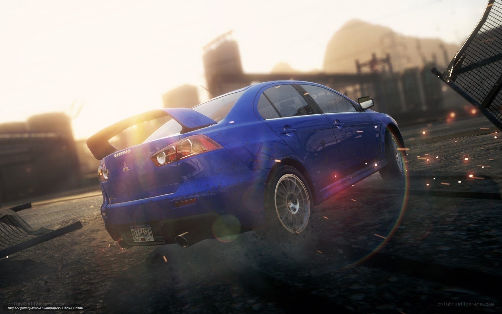 blue car drifting at sunset