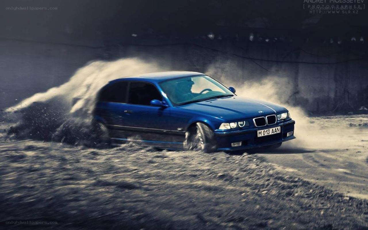 blue car drifting in dust
