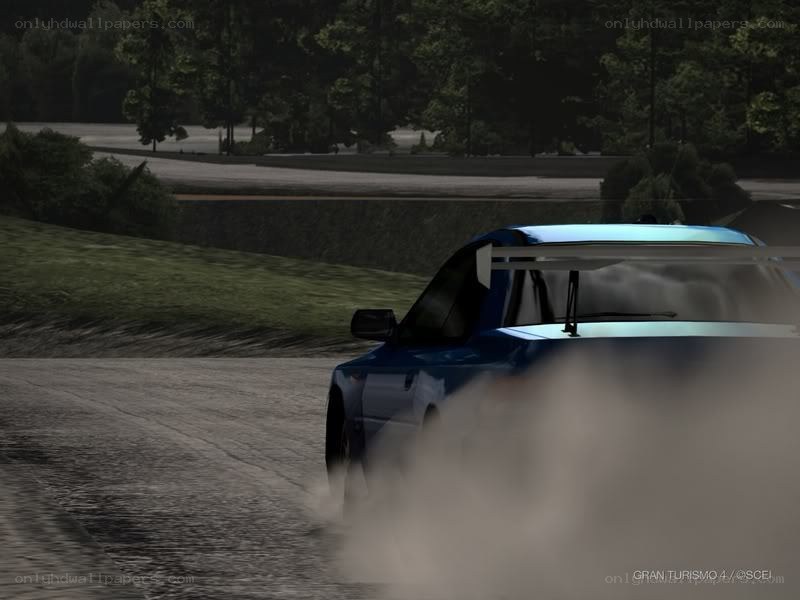 Blue car drifting on dirt