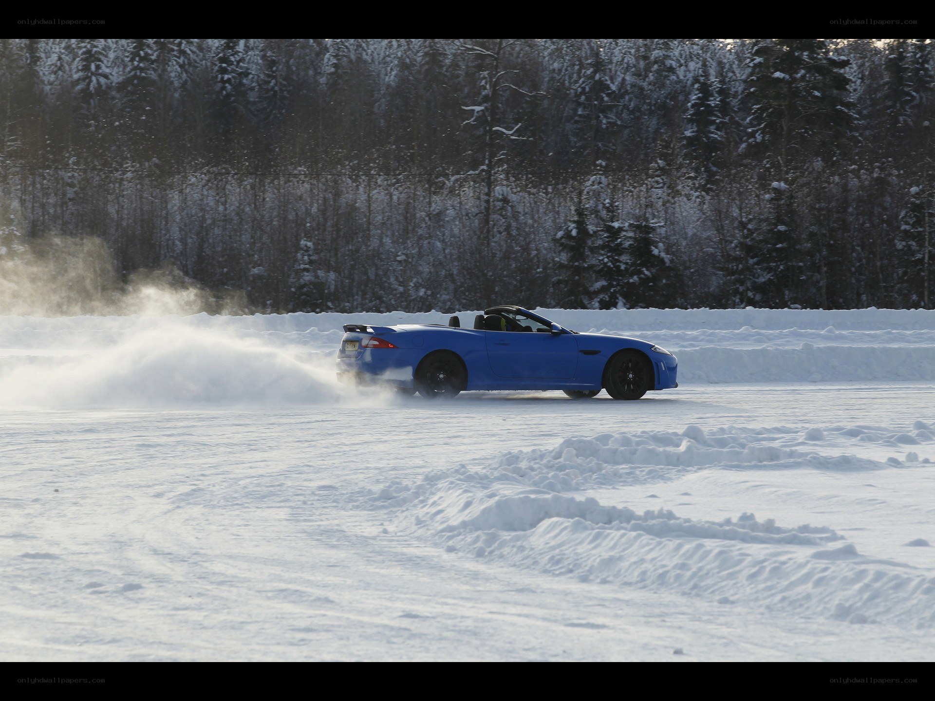 Blue car drifting on snow
