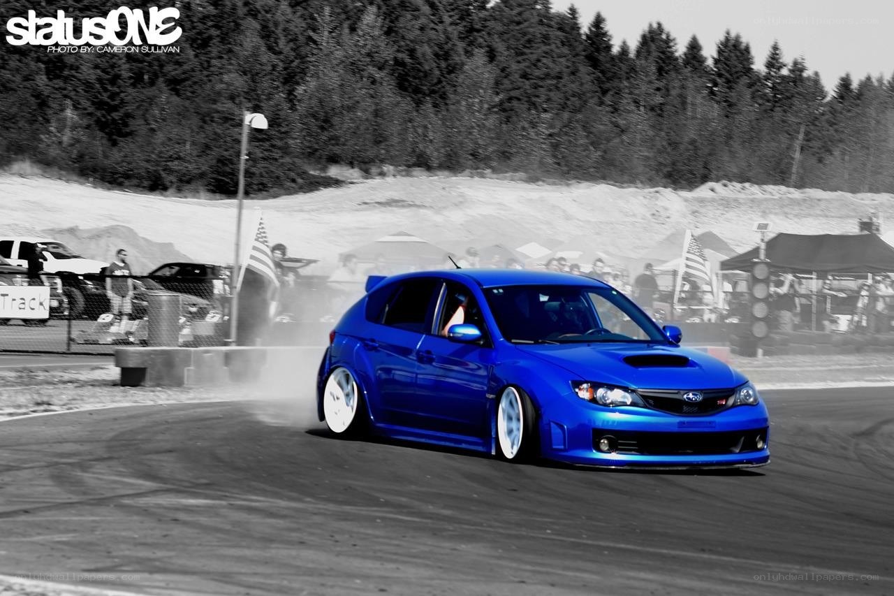 Blue car drifting on track