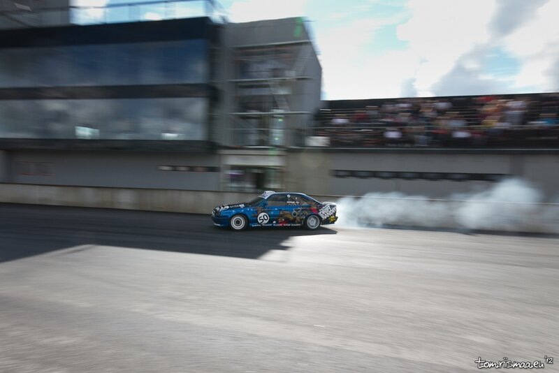 Blue car drifting on track