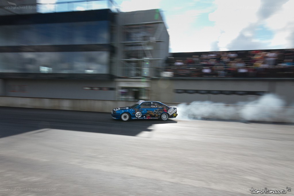 Blue car drifting on track