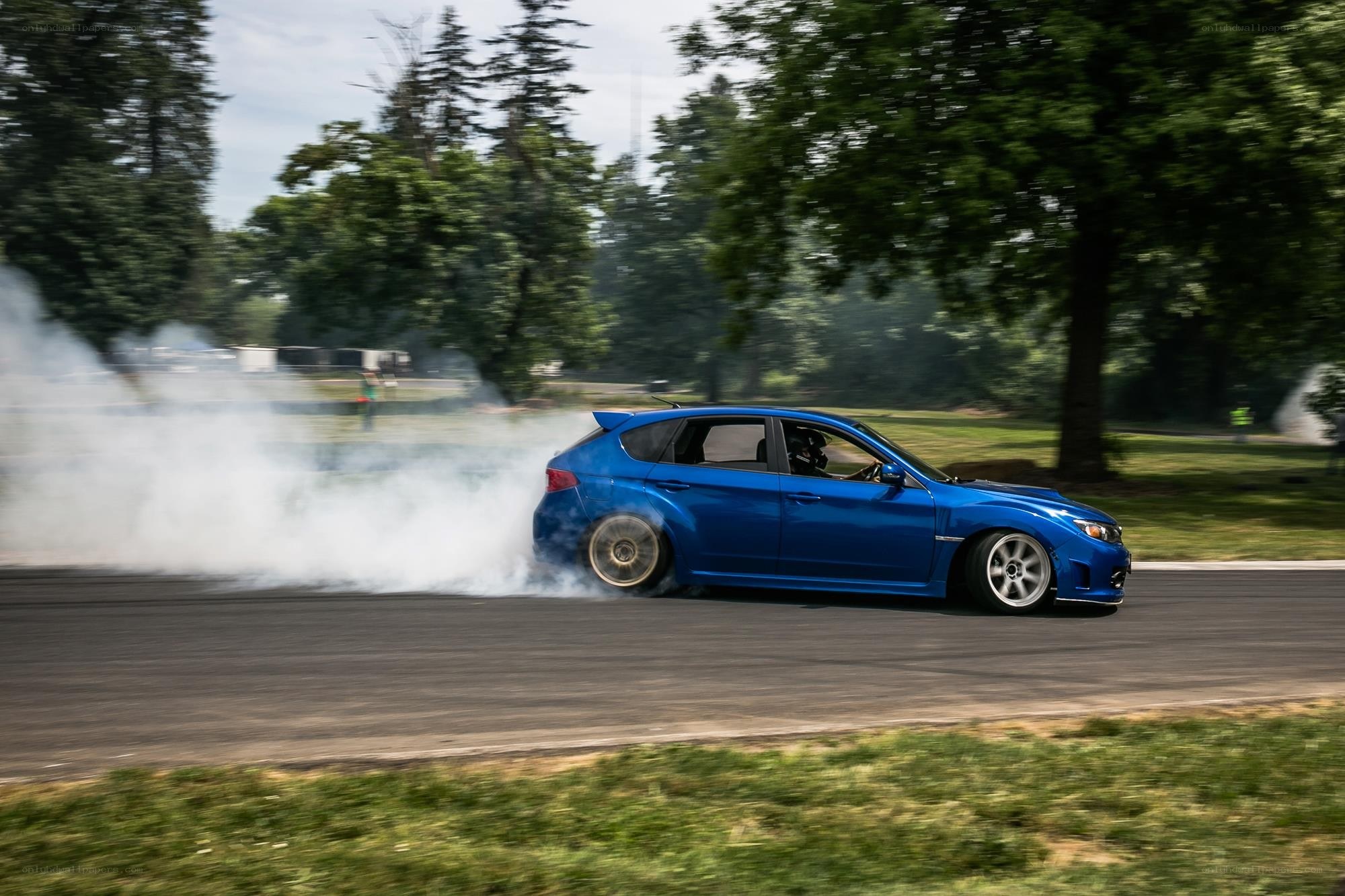 Blue car drifting on track