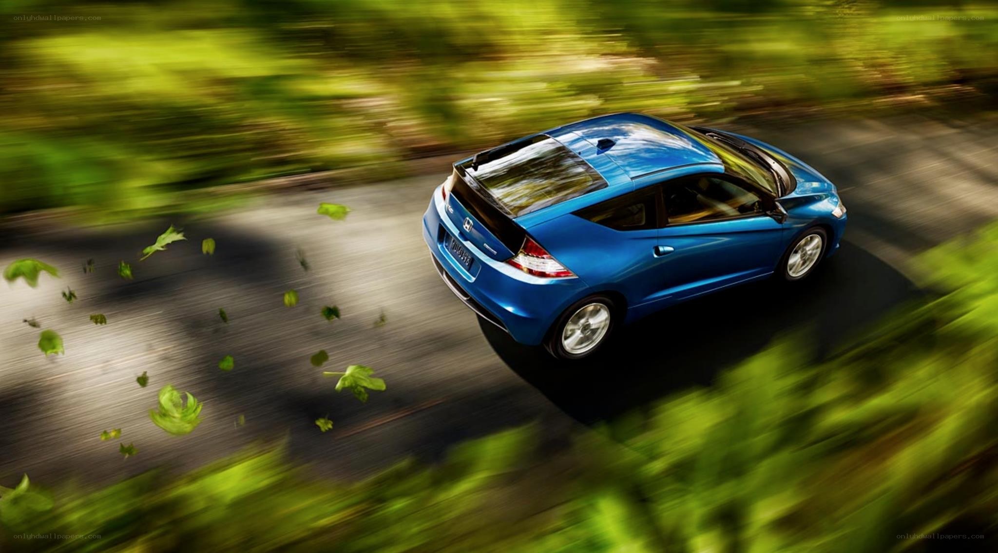 Blue car driving on road