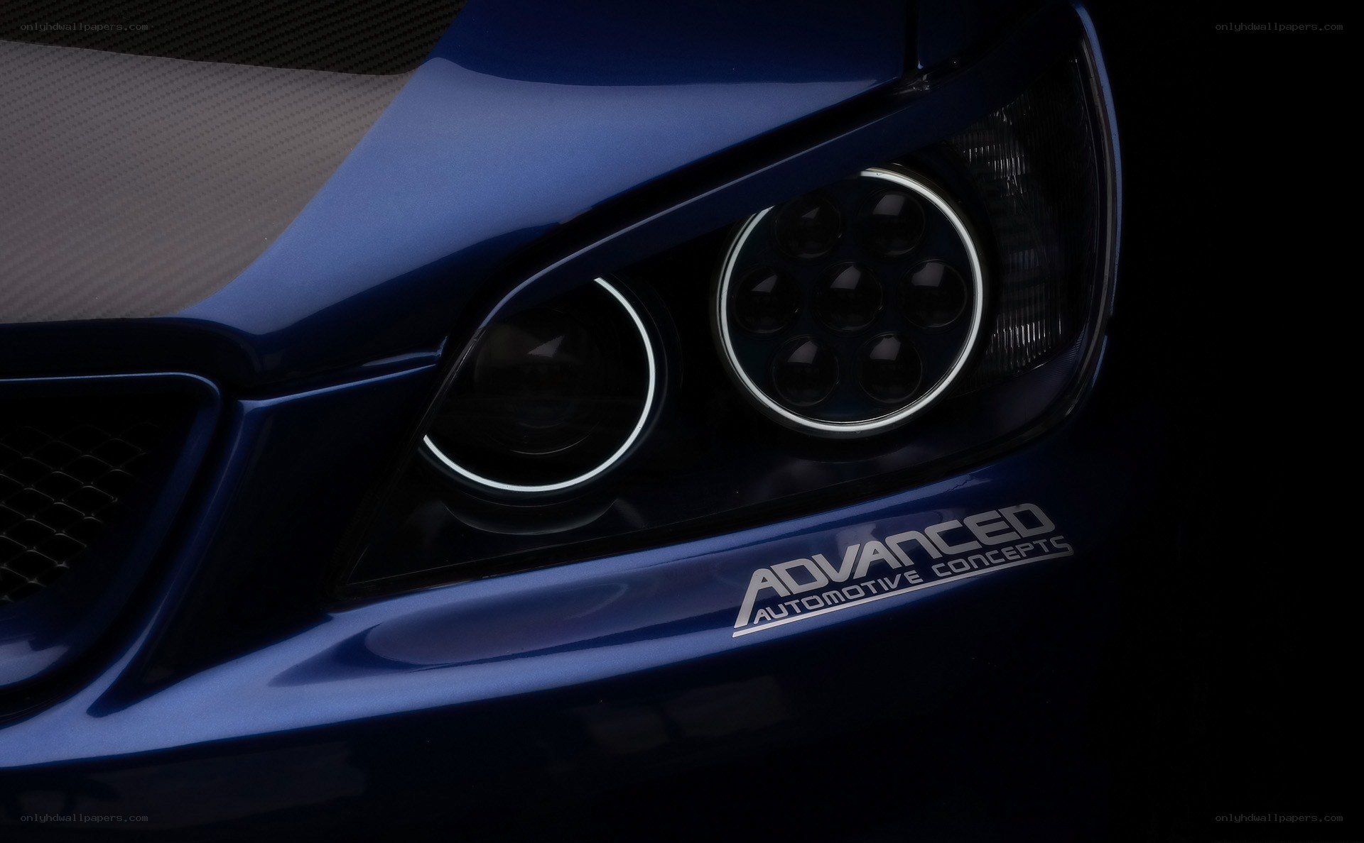 blue car headlight close-up