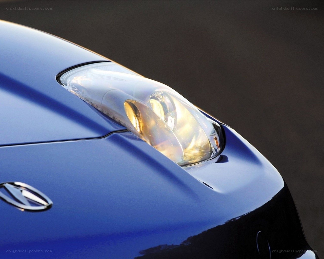 blue car headlight close-up