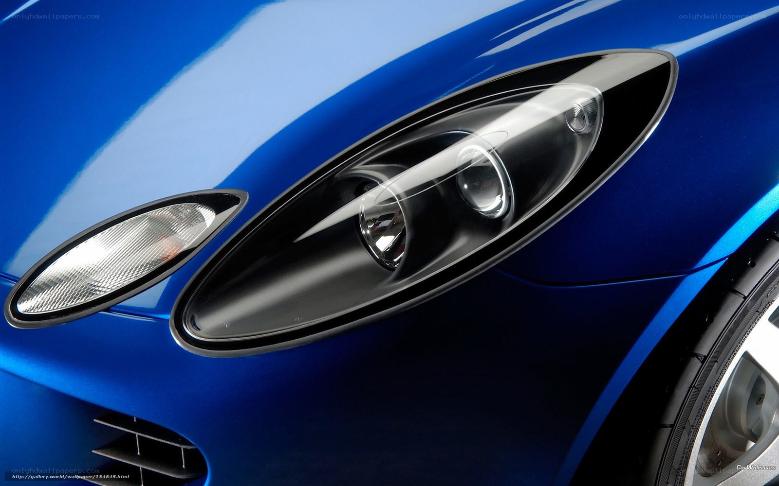 blue car headlight close-up