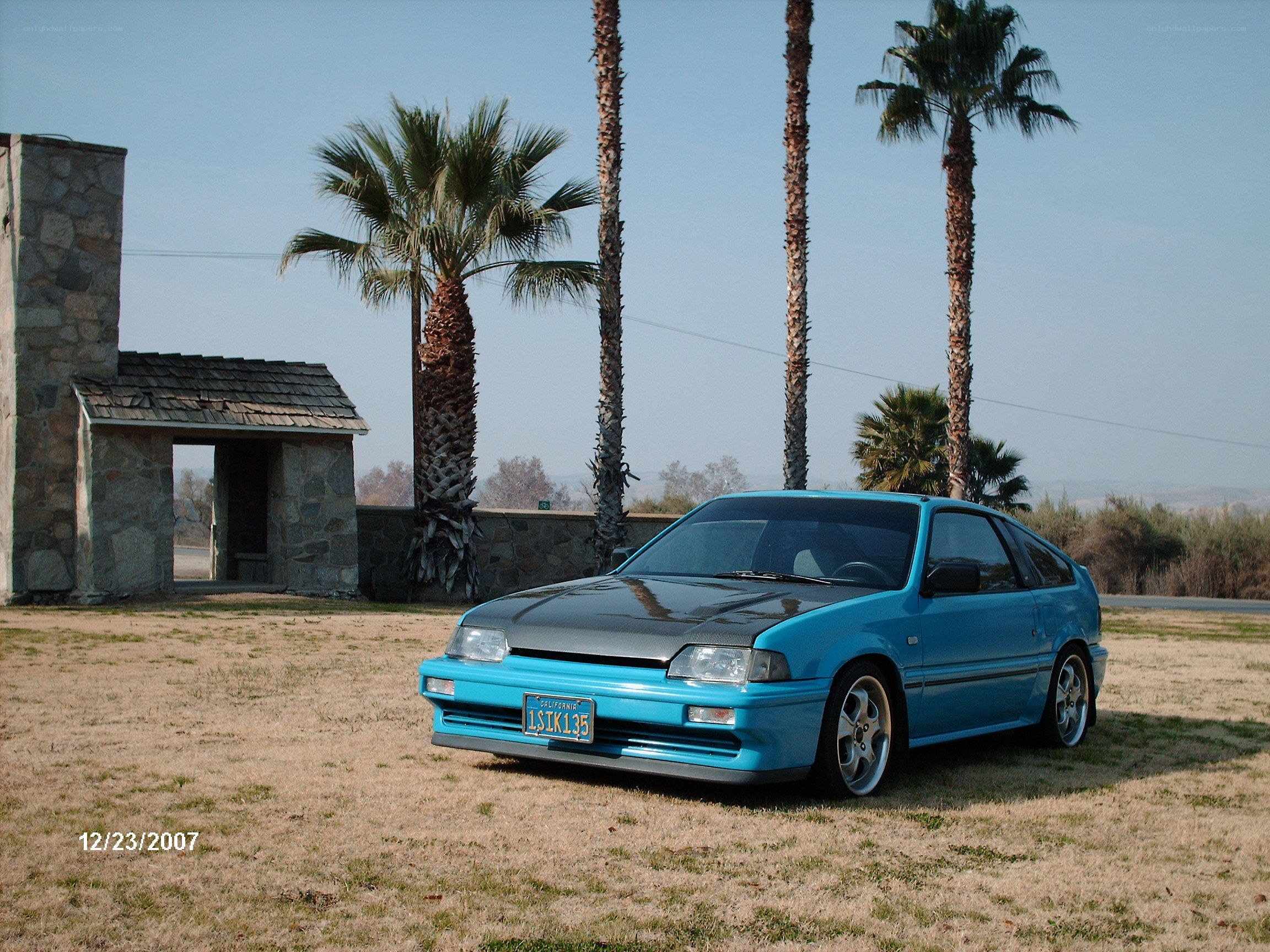 Blue car in a field