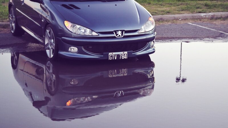Blue car in a puddle