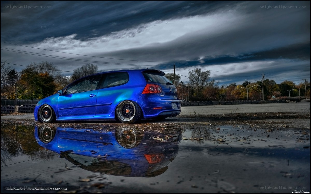 Blue car in a puddle