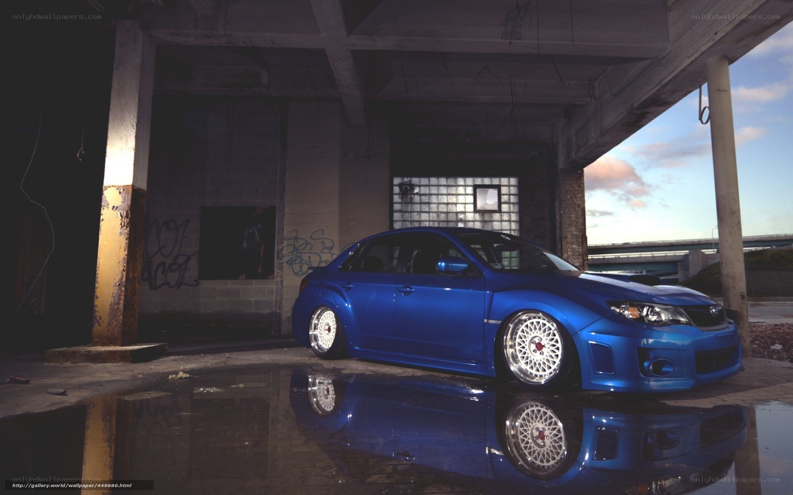 Blue car in abandoned garage
