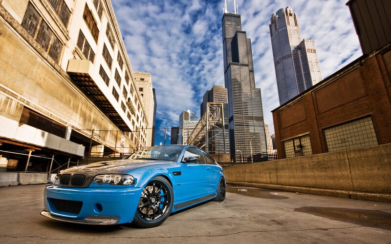 blue car in city alley