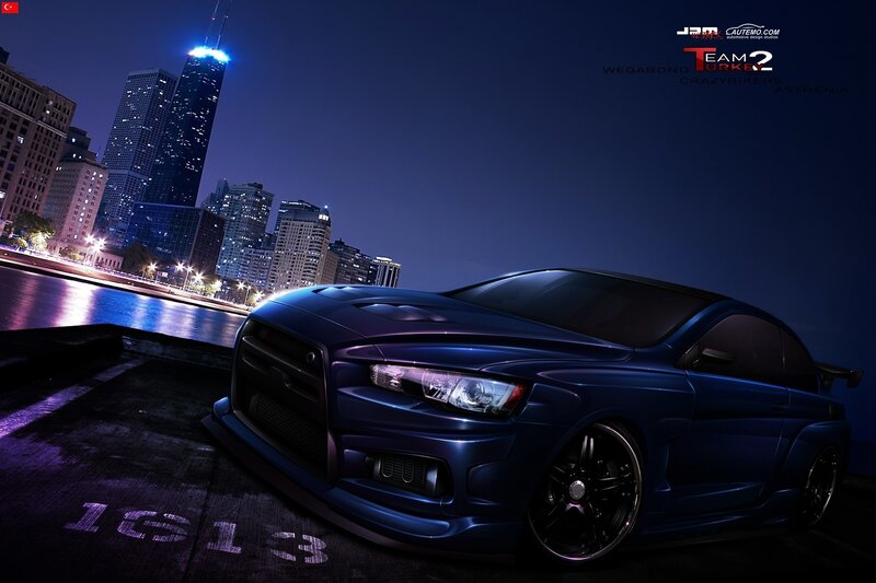 Blue car in city at night
