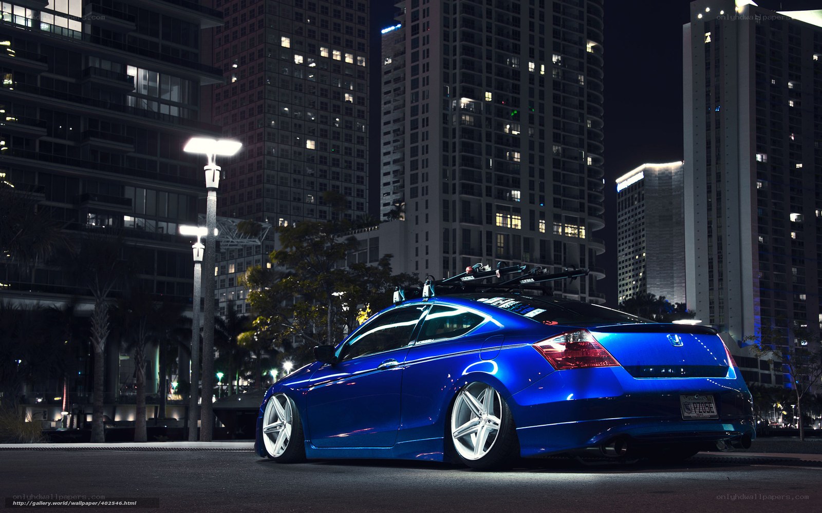 Blue car in city at night