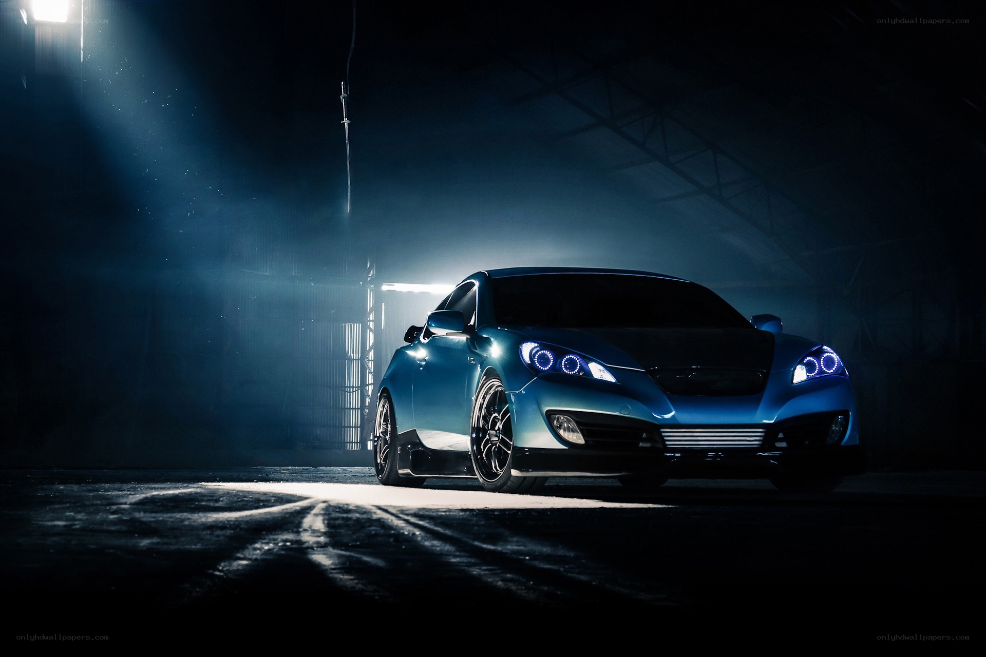 Blue car in dark garage