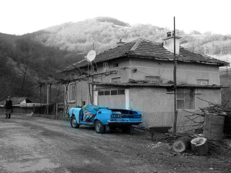 Blue Car in Front of House