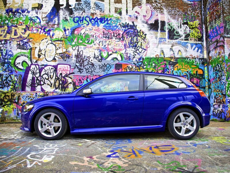 Blue car in graffiti alley