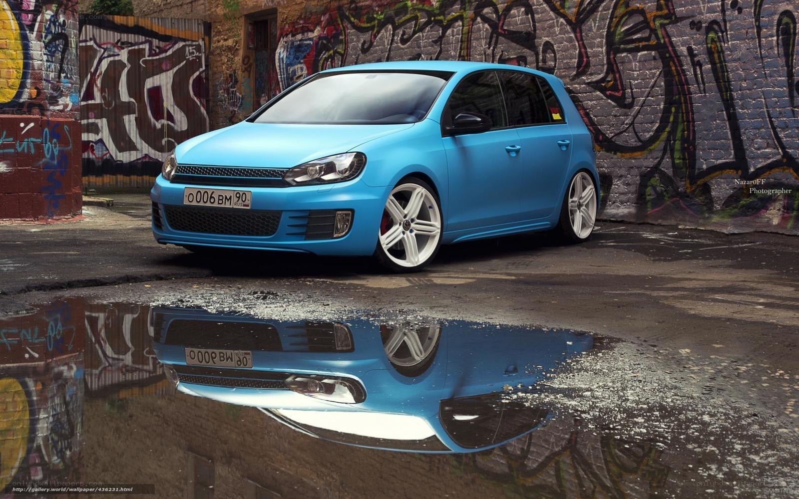 Blue car in graffiti alley