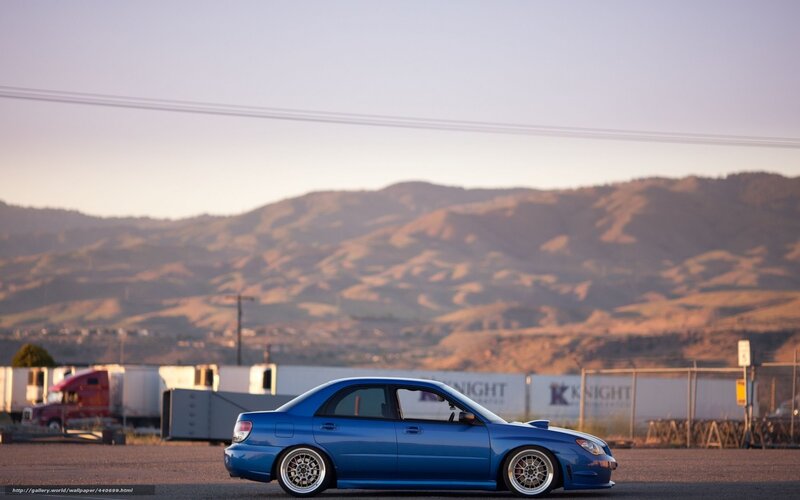 Blue car in industrial area
