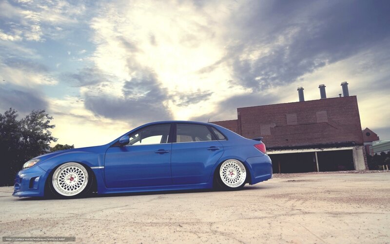 blue car in industrial setting