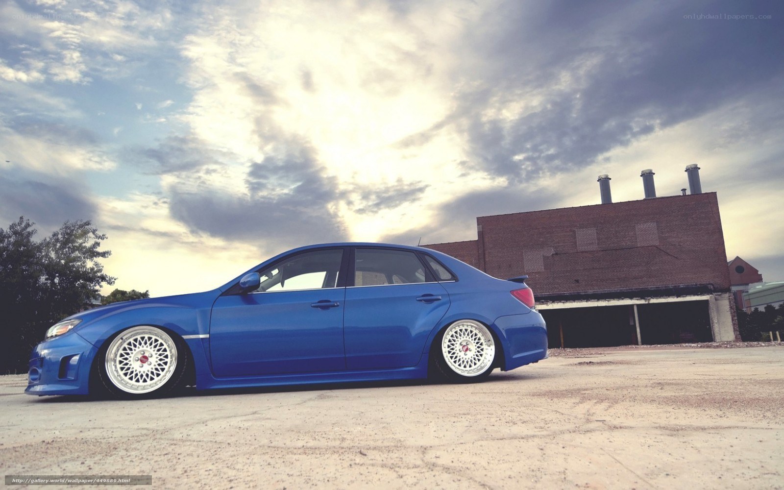 blue car in industrial setting