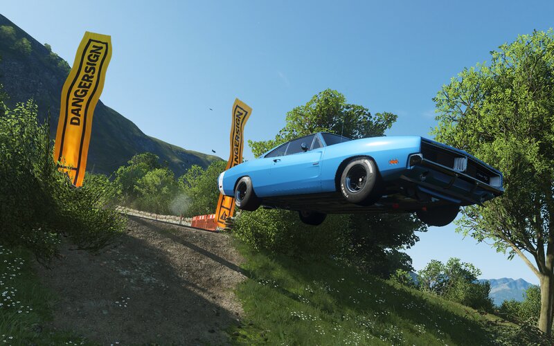 Blue Car in Mid-air — Dynamic, Afternoon