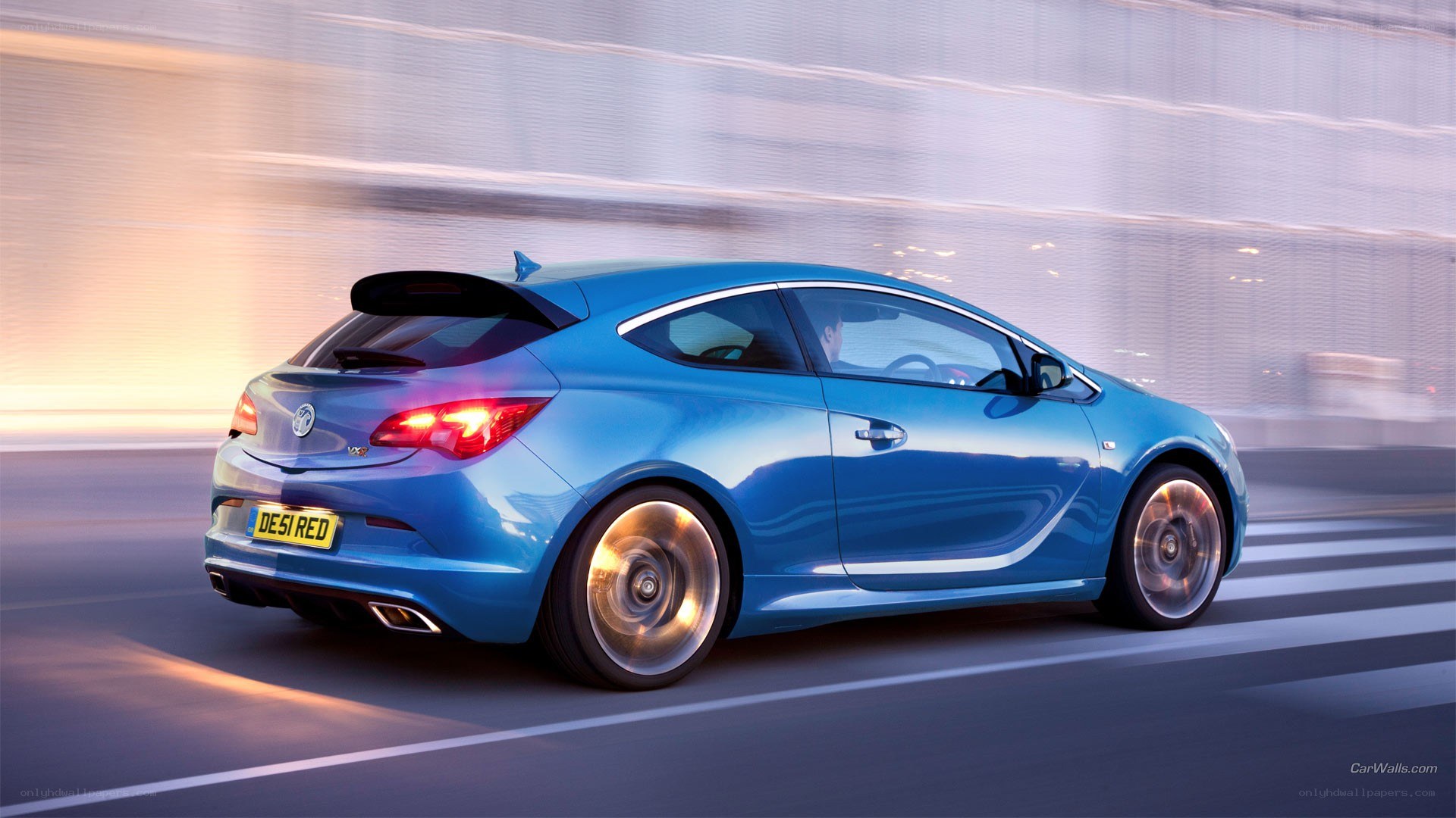 blue car in motion