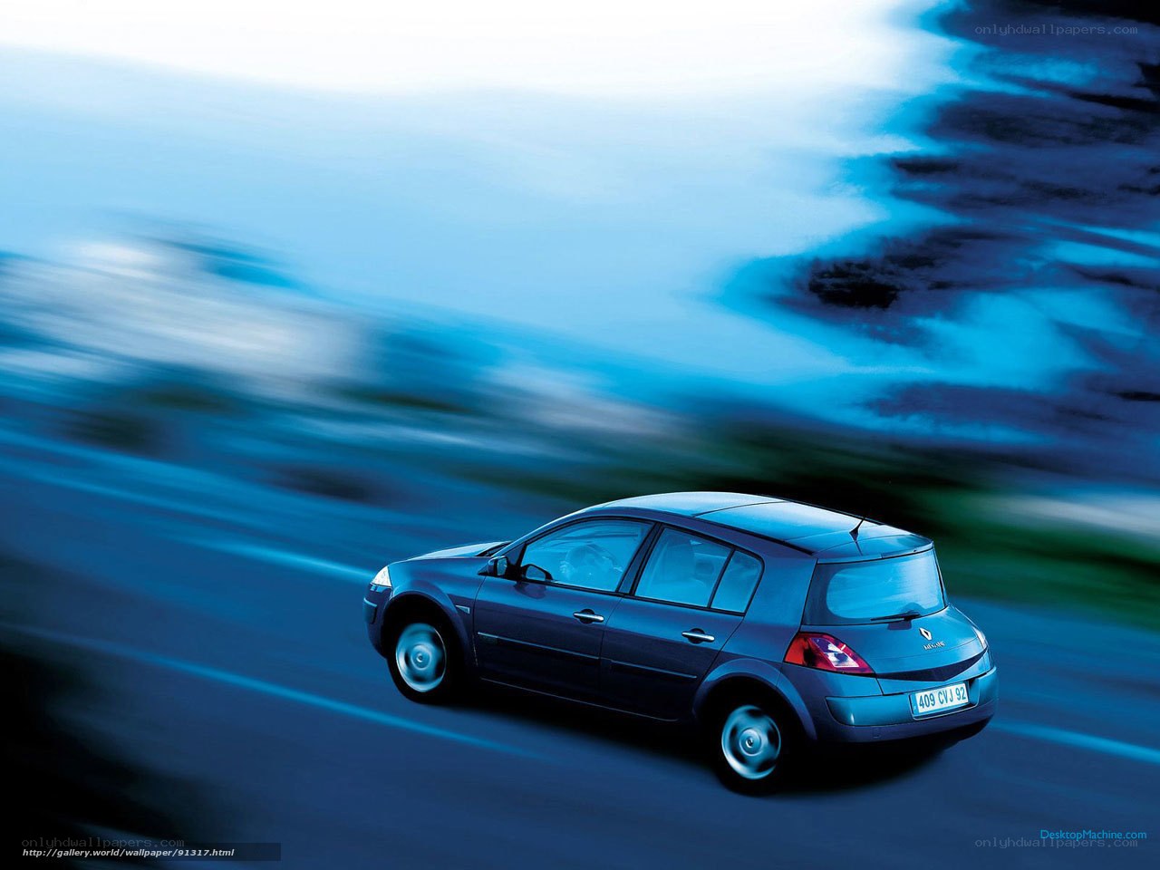 Blue car in motion on road