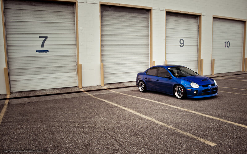 Blue car in parking lot