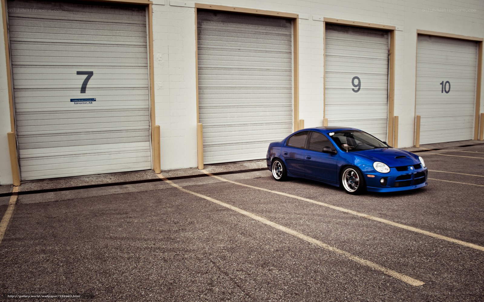 Blue car in parking lot