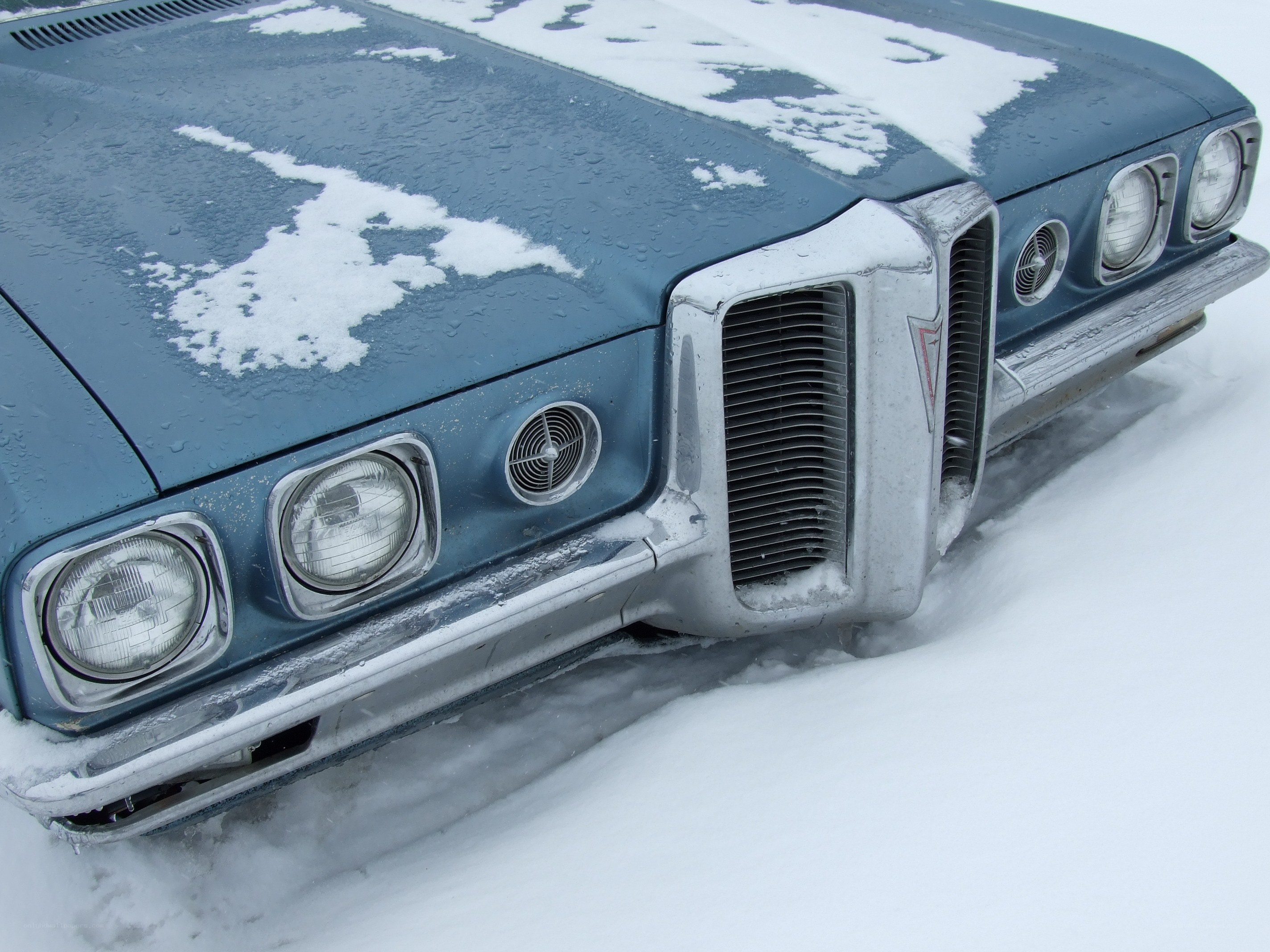 blue car in snow