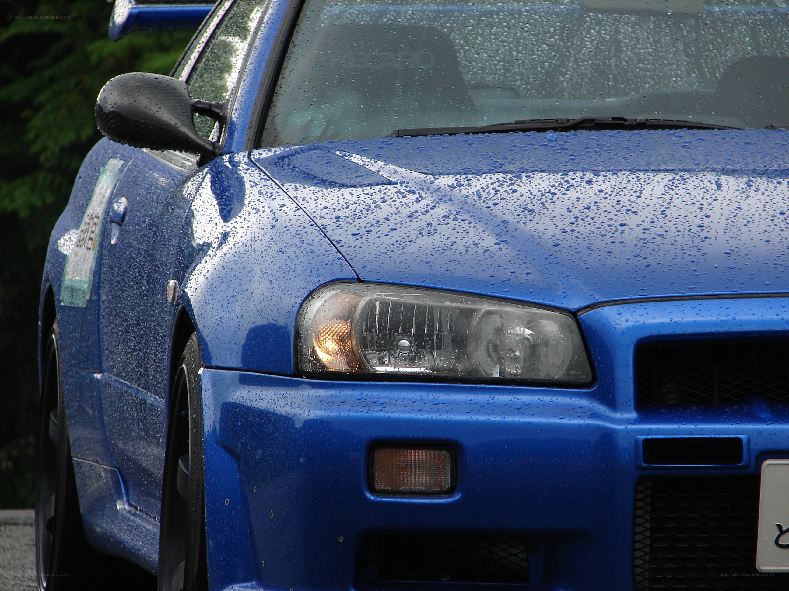 blue car in the rain