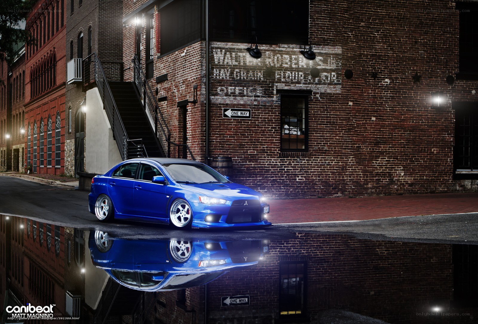 Blue car in urban alley
