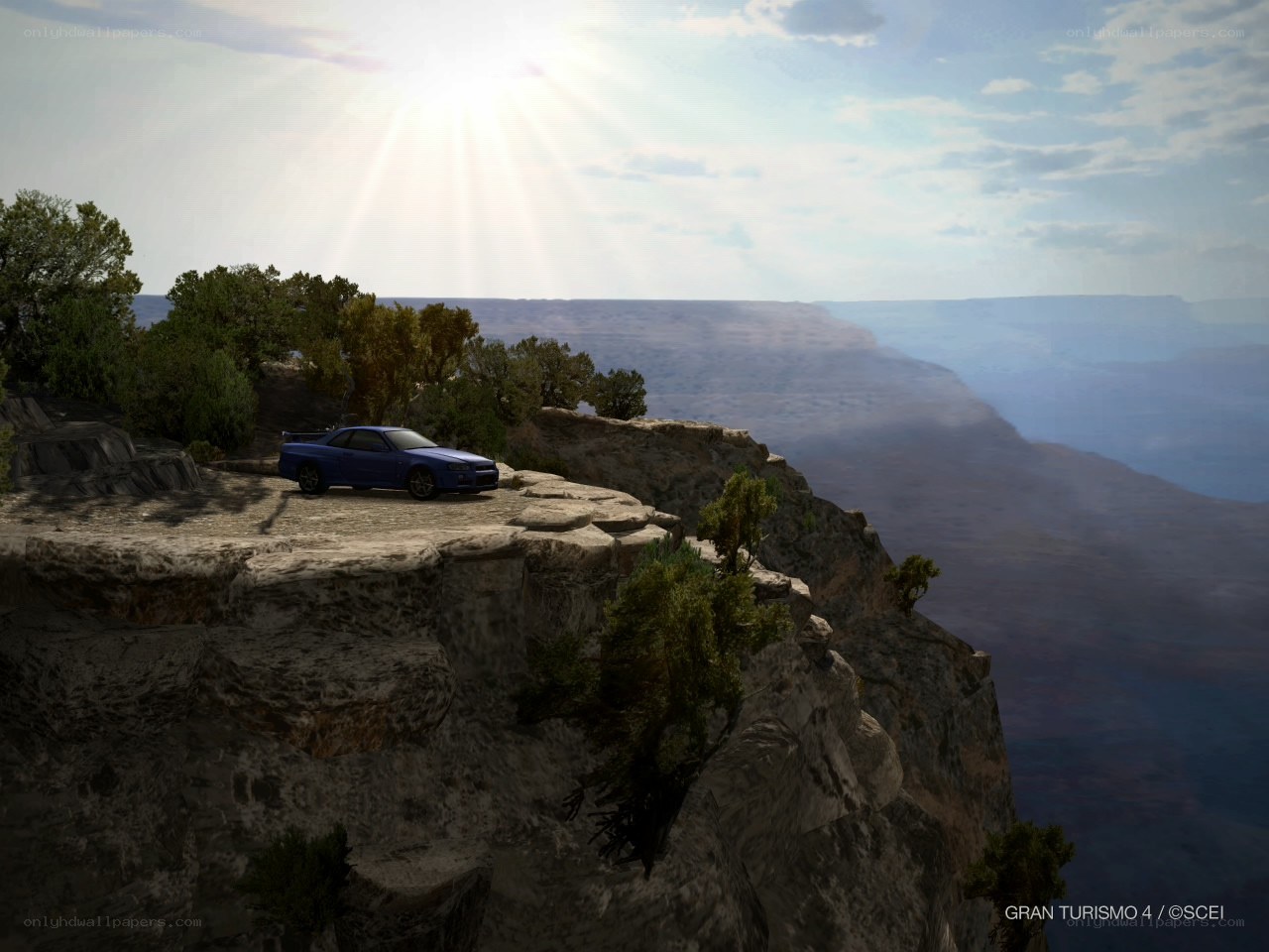 Blue car on a cliff edge