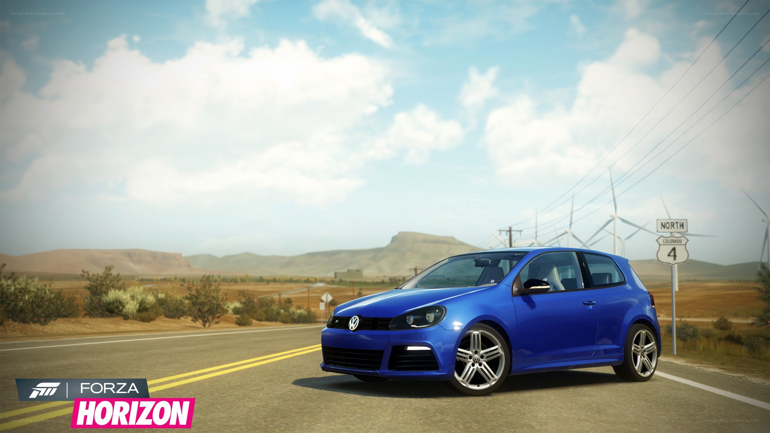 Blue car on a desert road