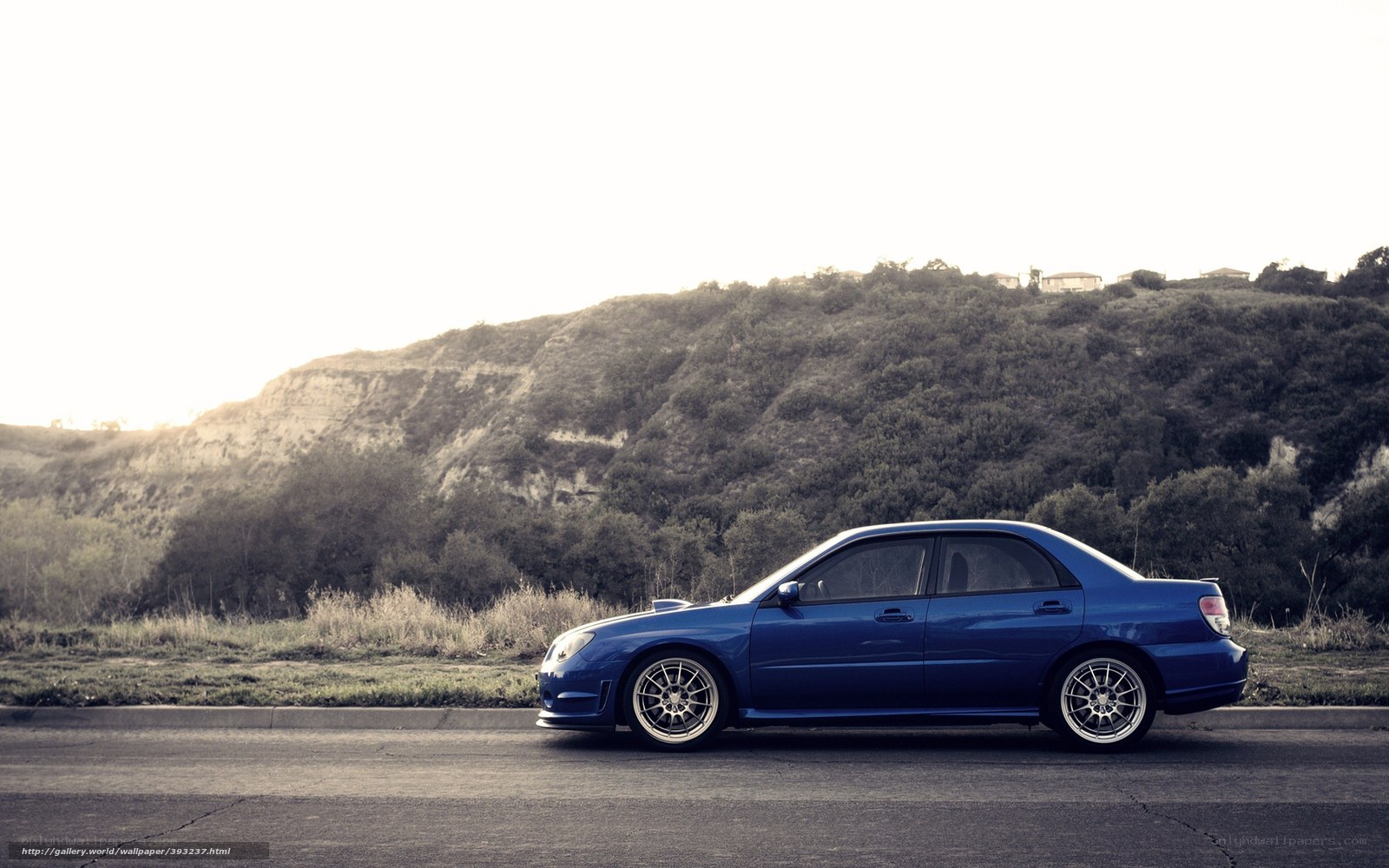 Blue car on a road