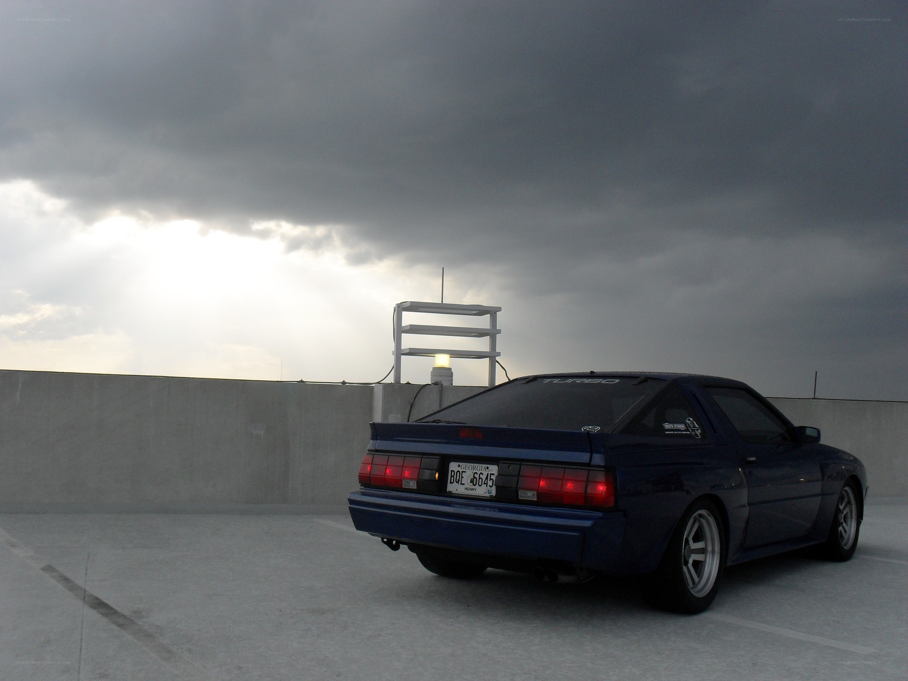Blue car on a rooftop