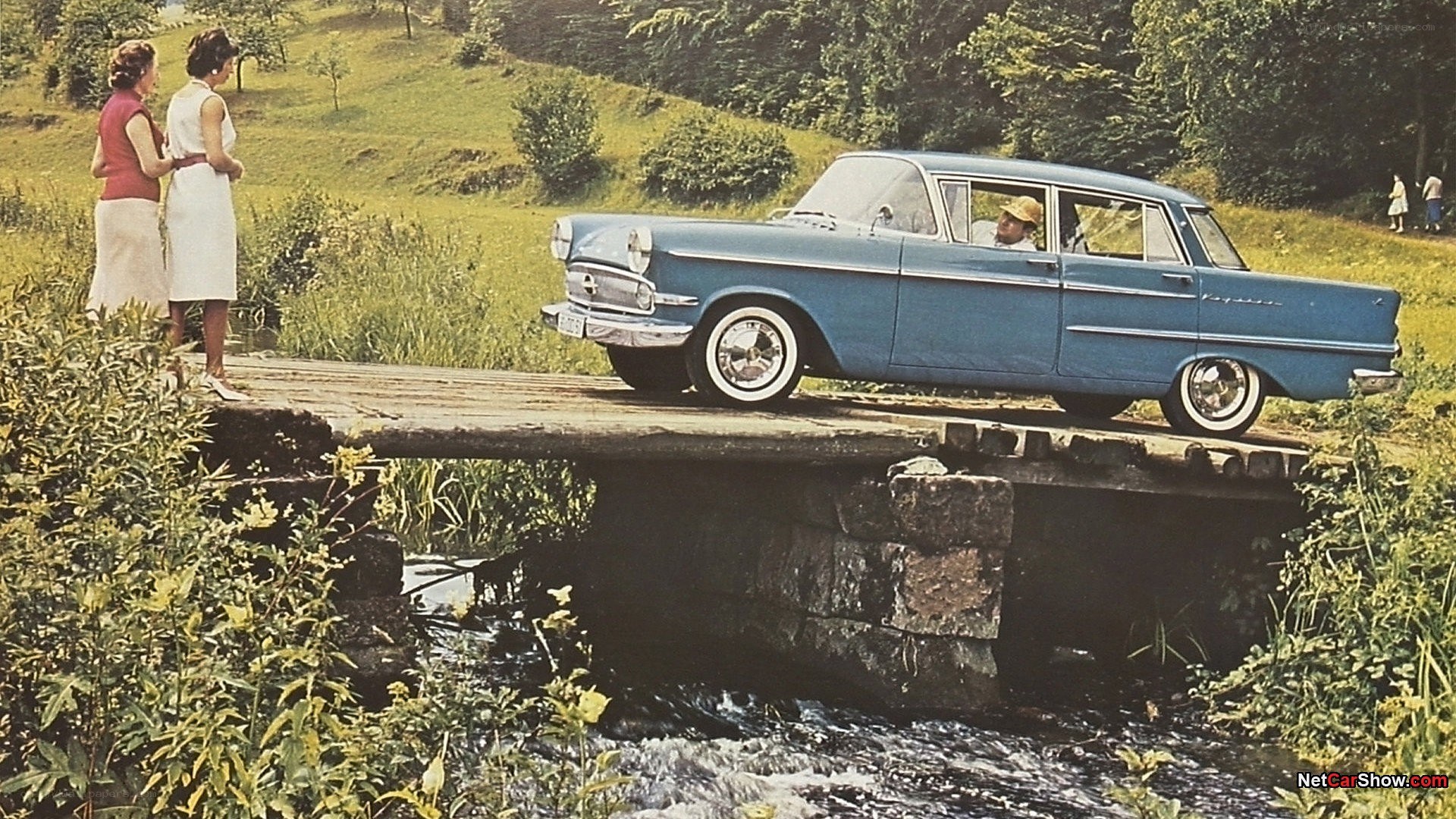 Blue car on a small bridge