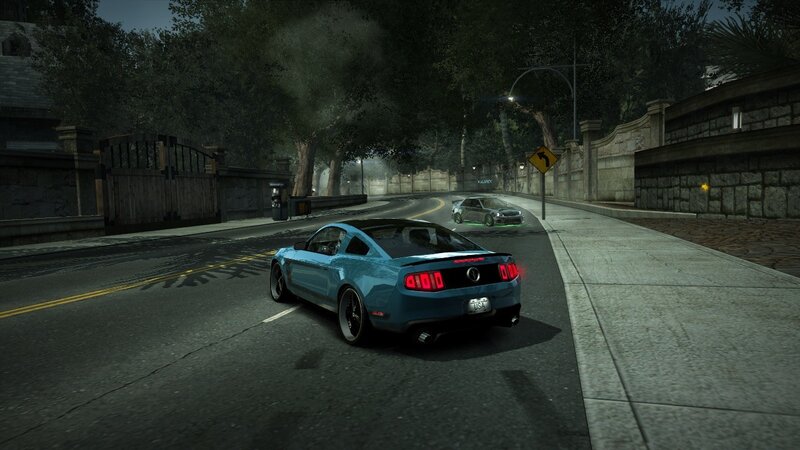 blue car on a winding road