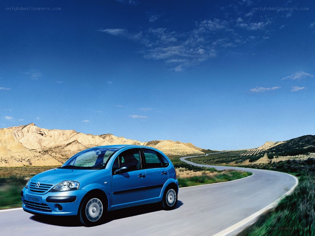 Blue car on a winding road