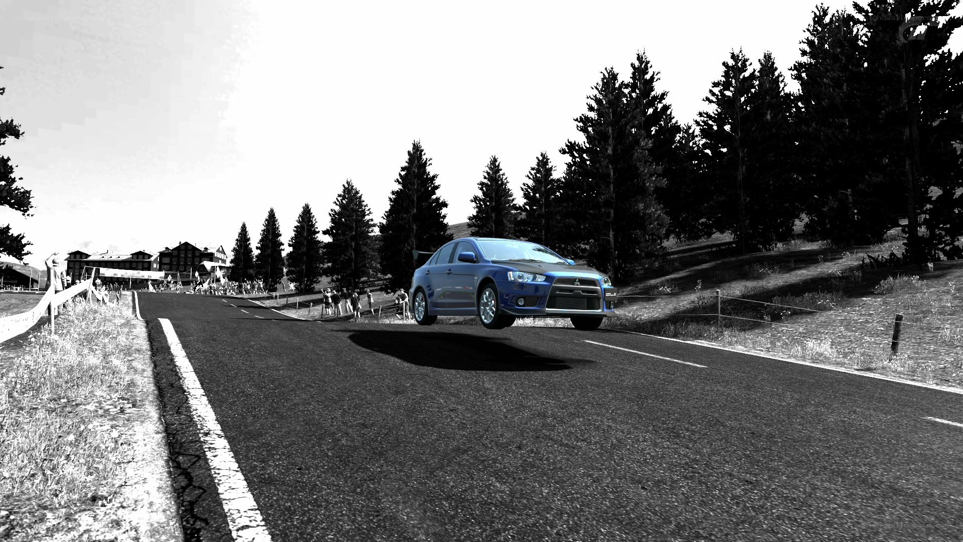 Blue car on a winding road