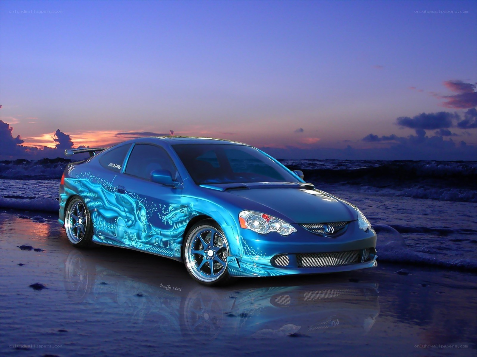 Blue car on beach at sunset