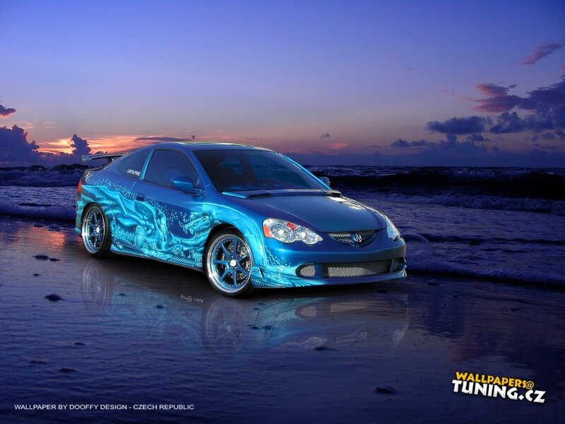 Blue car on beach at sunset
