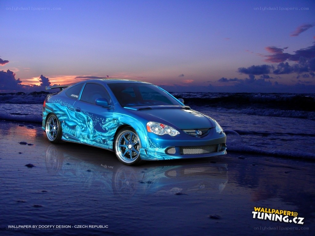 Blue car on beach at sunset
