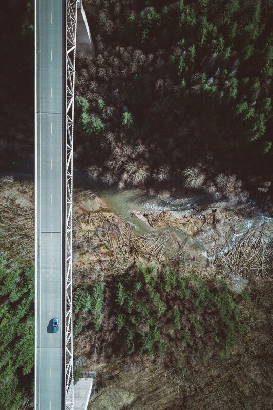 Blue Car on Bridge