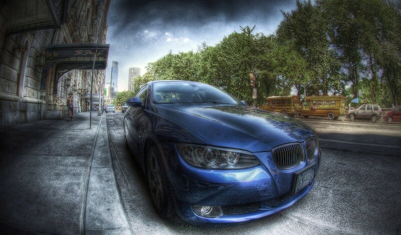 Blue car on city street
