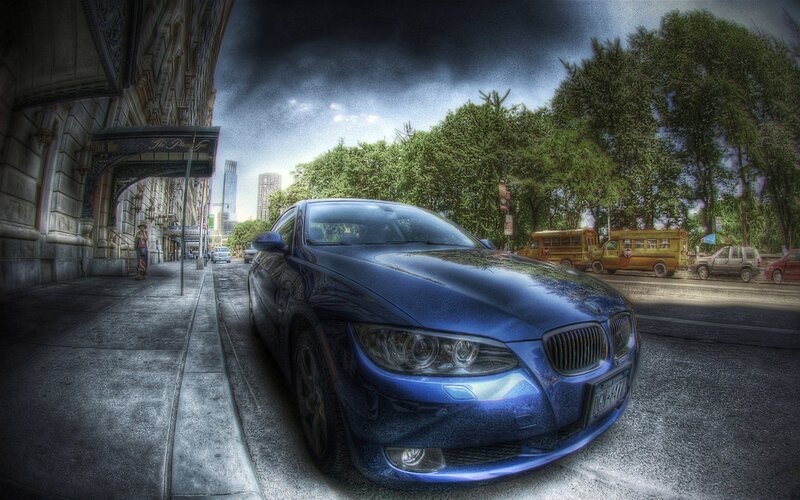 Blue car on city street