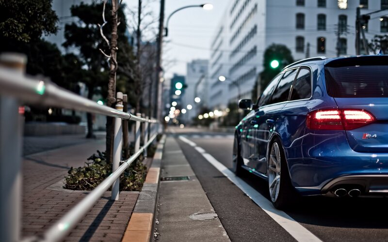 Blue car on city street