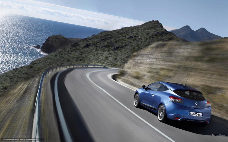Blue car on coastal road